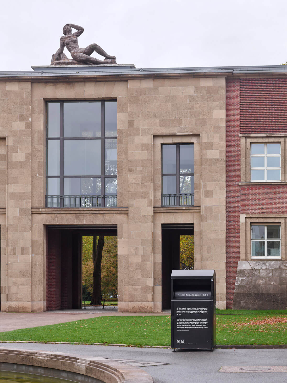 a black container in the courtyard of Kunstpalast